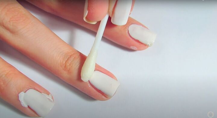 how to create cute nail art by painting nails with fingers, Cleaning up the nail polish with a q tip