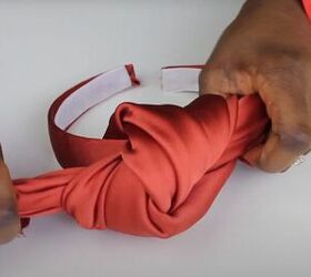 how to easily make diy braided top knot turban headbands, Slipping the headband through the knot