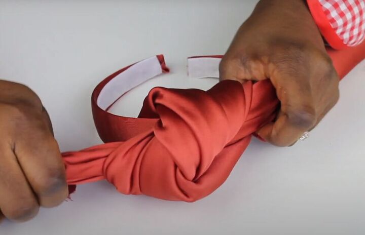 how to easily make diy braided top knot turban headbands, Slipping the headband through the knot