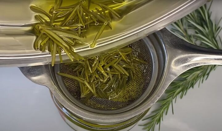 how to make use an effective diy rosemary oil for hair, Straining the DIY rosemary infused olive oil
