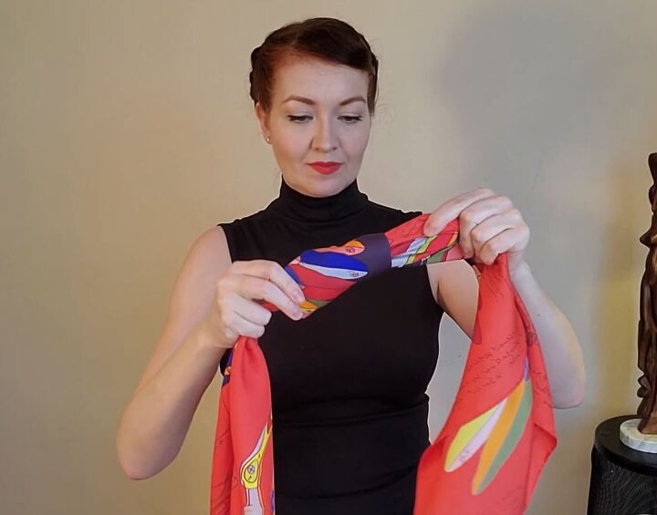 6 elegant audrey hepburn scarf styles how to wear them, Tying a knot in a silk scarf