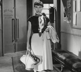 6 elegant audrey hepburn scarf styles how to wear them, Audrey Hepburn wearing a scarf over her shoulders