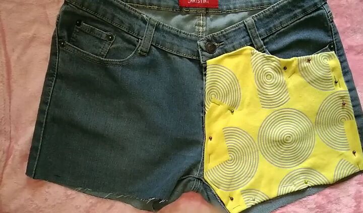 how to easily upcycle shorts to make them more summery, Pinning the yellow fabric to the shots