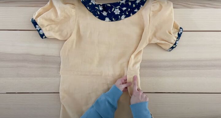 how to sew a diy peter pan collar dress using free patterns, Stitch in the ditch by the side seam