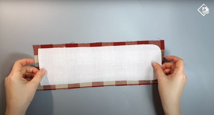 how to sew a cute practical diy card wallet from scratch, Placing the fusible fleece on top of the fabric