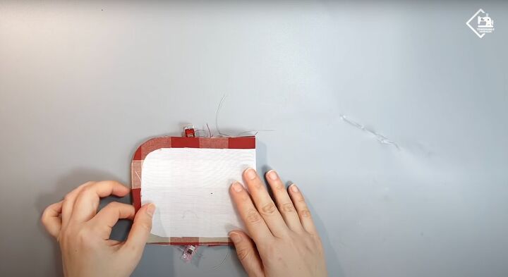 how to sew a cute practical diy card wallet from scratch, Flattening the folds with fingers