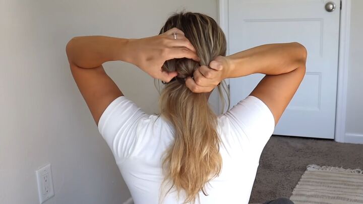 4 quick easy cute work hairstyles that look professional, Flipping the ponytail through the hole