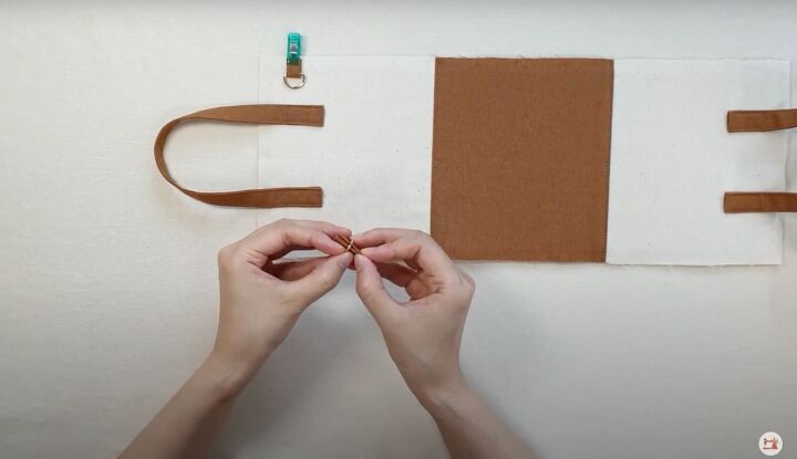 how to make a mini purse that can hold all your essentials, Folding the tabs for the bag