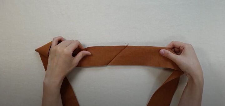 how to easily make a diy crossbody strap for a bag or purse, Flattening the seam allowance