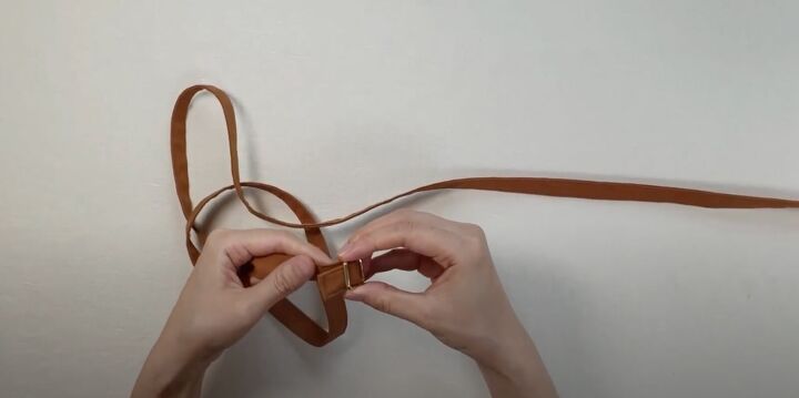 how to easily make a diy crossbody strap for a bag or purse, Inserting the slide buckle onto the strap