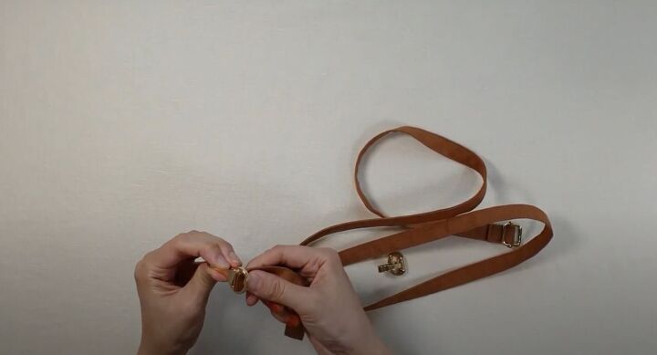 how to easily make a diy crossbody strap for a bag or purse, Inserting the lobster clasp