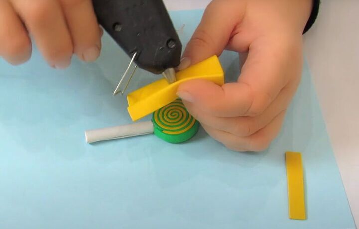 how to make adorable diy candy hair clips using foam glue, Gluing the center of the foam to make a bow