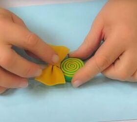 how to make adorable diy candy hair clips using foam glue, Gluing the bow to the stick
