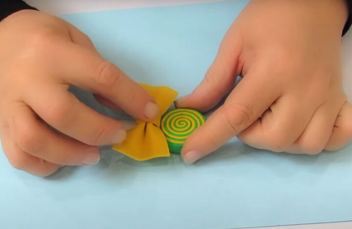 how to make adorable diy candy hair clips using foam glue, Gluing the bow to the stick
