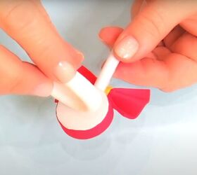 how to make adorable diy candy hair clips using foam glue, Gluing the candy piece to elastic hair ties