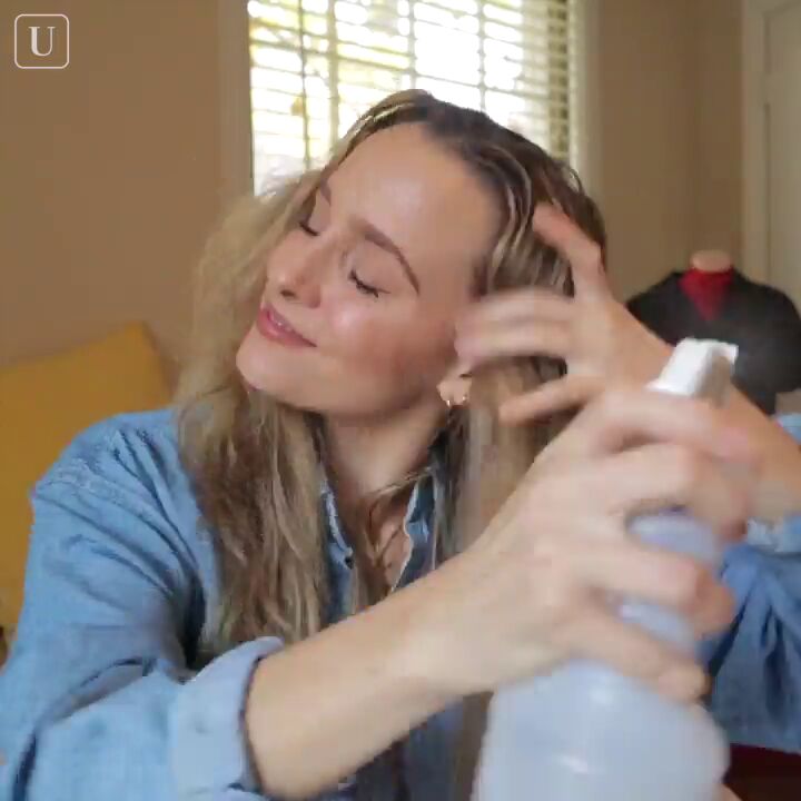 how to curl your hair overnight with pantyhose or a robe tie, Dampening hair by spritzing water