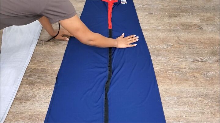 how to make a jumpsuit out of a long dress quickly easily, Laying the marked maxi dress on the floor