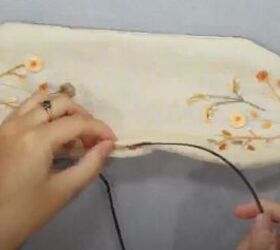 how to make a cute diy knotted headband with embroidery, Inserting the headband into the fabric