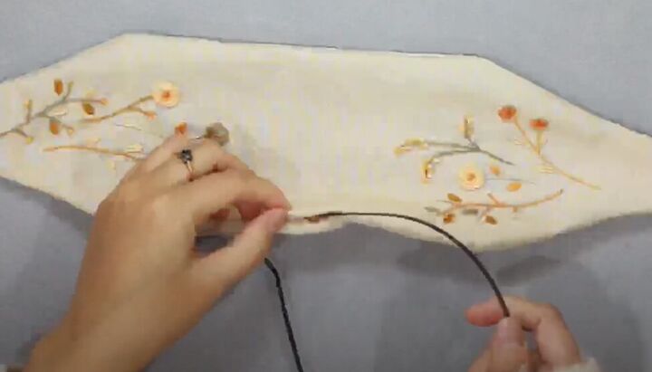 how to make a cute diy knotted headband with embroidery, Inserting the headband into the fabric