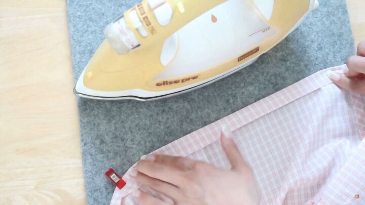 how to make a cute diy off shoulder dress out of a men s shirt, Pressing the DIY off shoulder dress