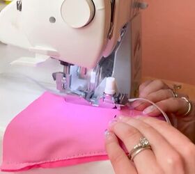 how to make a wrap bikini top with a unique asymmetrical design, Sewing the DIY bikini top with an overlock machine