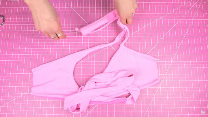 how to make a wrap bikini top with a unique asymmetrical design, Sewing the side seams of the bikini top