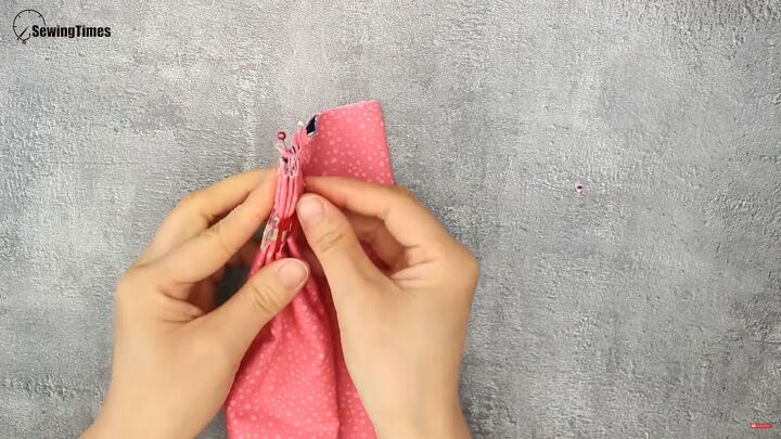 how to sew a cute diy cosmetic bag for carrying makeup, Clipping the layers to secure them