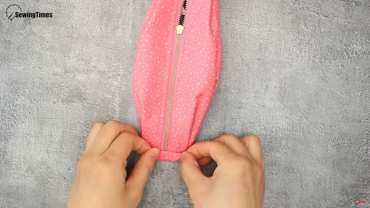 how to sew a cute diy cosmetic bag for carrying makeup, Folding the edges inwards