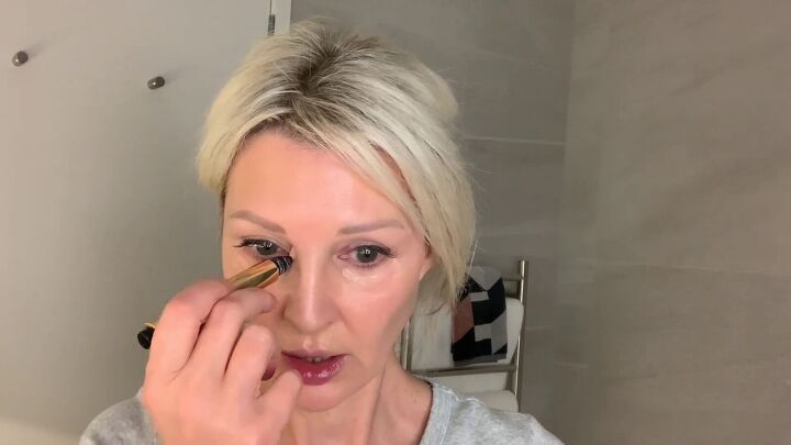 looking for quick glam try this get ready with me makeup tutorial, Applying a lighter concealer to the shadow