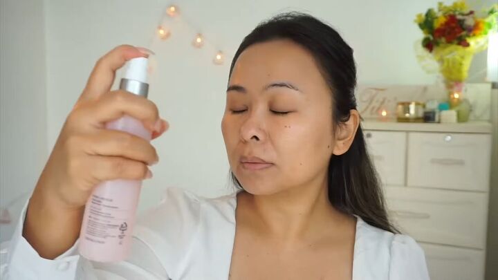how to create a fresh dewy bright spring makeup look, Spraying hydrating mist before applying makeup