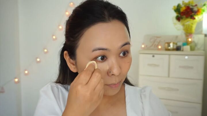 how to create a fresh dewy bright spring makeup look, Applying concealer under the eyes