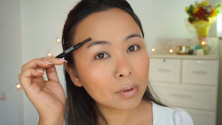 how to create a fresh dewy bright spring makeup look, Shaping brows with a spoolie brush
