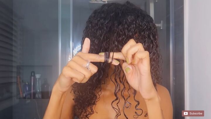 how to create a cute faux lion cut hairstyle using stockings, Twisting curls around the fingers