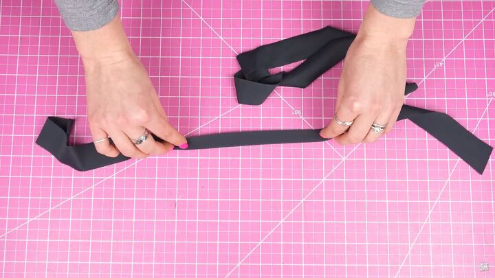 how to make your own swimsuit with a sexy cutout keyhole design, Folding the straps ready to sew