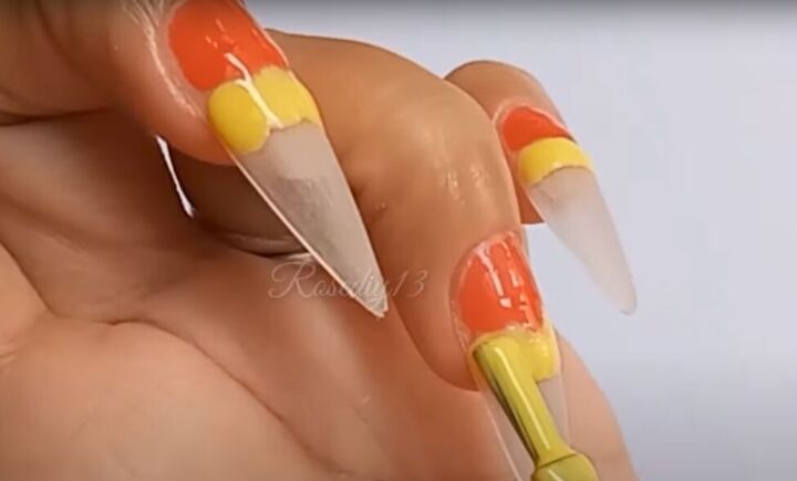 how to do easy diy gel nail art in fiery orange yellow black, Applying yellow gel nail polish