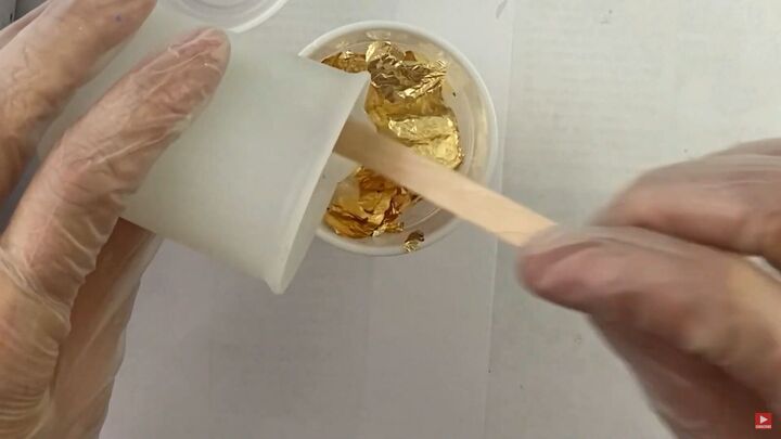 how to make pretty resin ocean wave earrings with gold foil, Adding gold foil to the resin