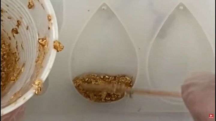 how to make pretty resin ocean wave earrings with gold foil, Placing the gold resin at the bottom of the mold