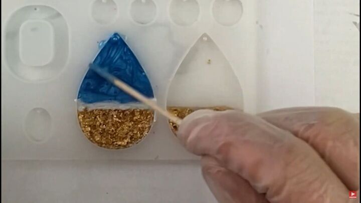 how to make pretty resin ocean wave earrings with gold foil, Placing the blue resin at the top