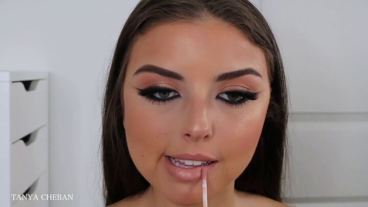 how to recreate kim kardashian s makeup complete with contour, Topping the lips with liquid lipstick
