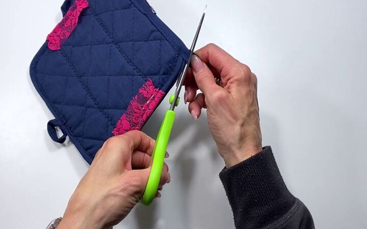 how to sew a cute zipper pouch using 2 dollar store potholders, Trimming the zipper tails