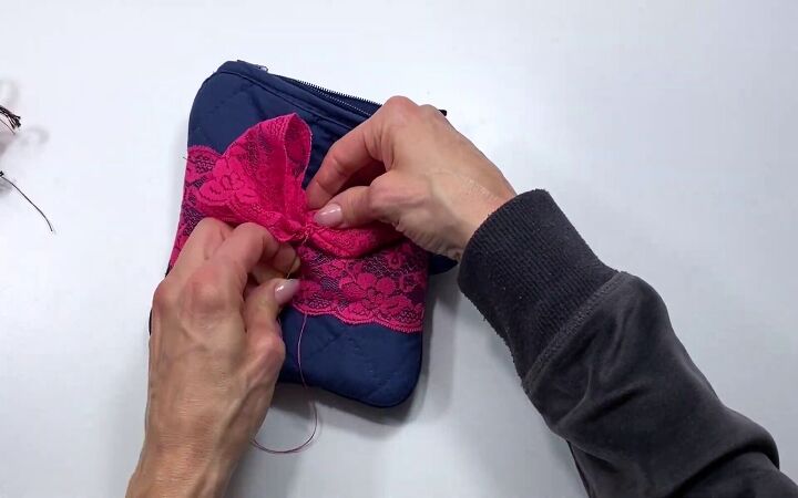 how to sew a cute zipper pouch using 2 dollar store potholders, Adding a bow for decoration