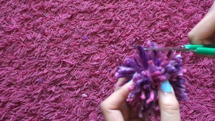 how to easily make cute diy pom pom hair clips in 4 simple steps, Trimming the pom poms