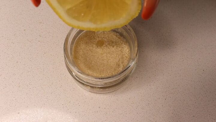 how to make a gentle diy sugar scrub for your face in 5 easy steps, Squeezing the juice out of a lemon