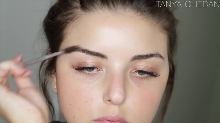 are your eyebrows getting a little unruly try this easy brow tutorial, Brushing brows with a spoolie brush