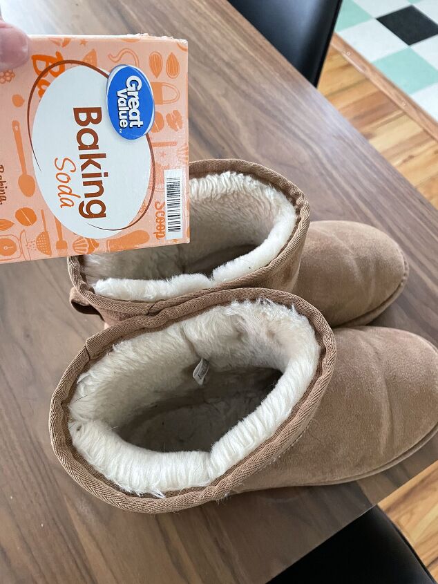 how to make the inside of uggs fluffy again, baking soda being poured into Ugg boots