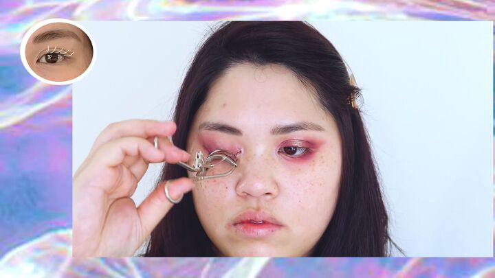how to do sexy dramatic fox eye makeup with pops of pink purple, Curling lashes with an eyelash curler