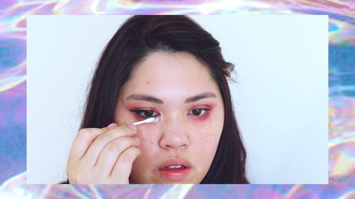 how to do sexy dramatic fox eye makeup with pops of pink purple, Cleaning up the fox eyeliner
