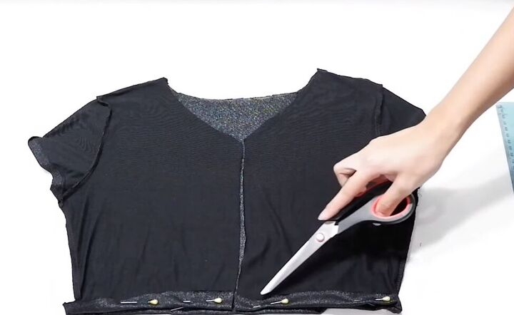 how to cut a t shirt into a crop top in 4 super cute ways, Cutting the bottom off the t shirt