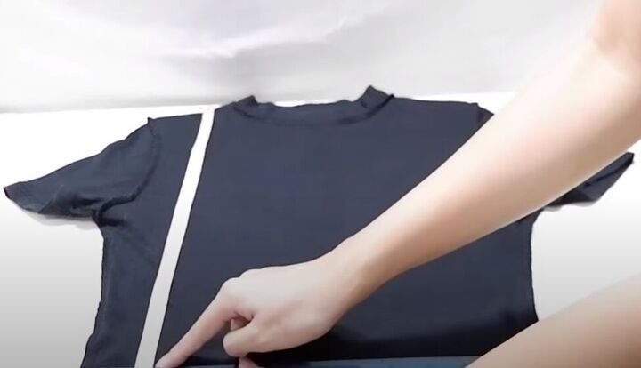 how to cut a t shirt into a crop top in 4 super cute ways, Measuring where to crop the t shirt