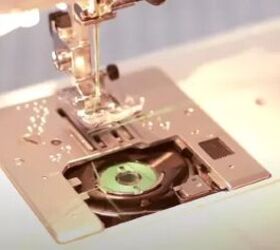 how to replace a sewing machine needle in under 5 minutes, up close shot of sewing machine needle and feed plate